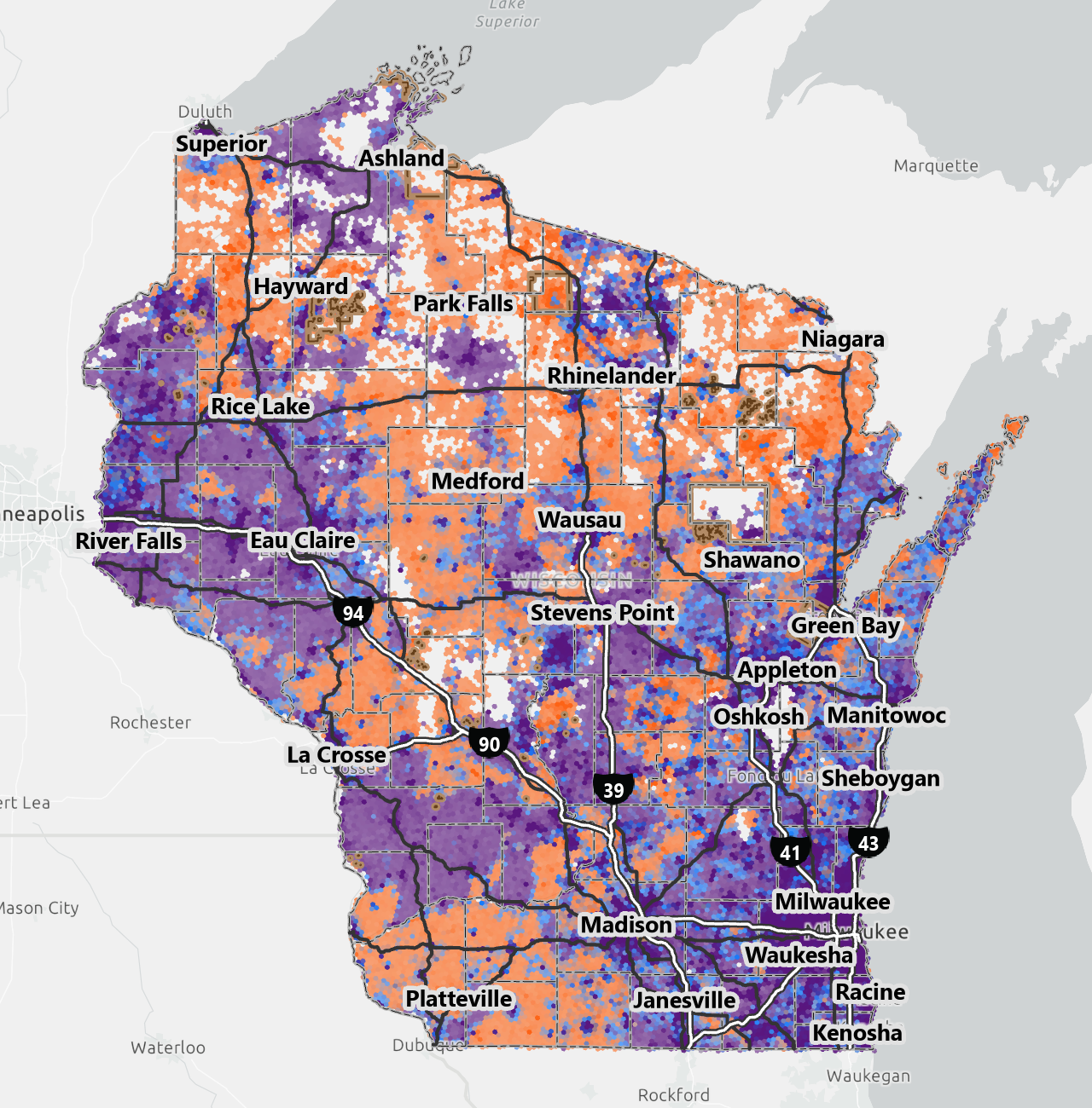 A map of Wisconsin shows the distribution of rural (orange), suburban (gray), and urban (purple) areas, with major cities and highways labeled in black and white.
